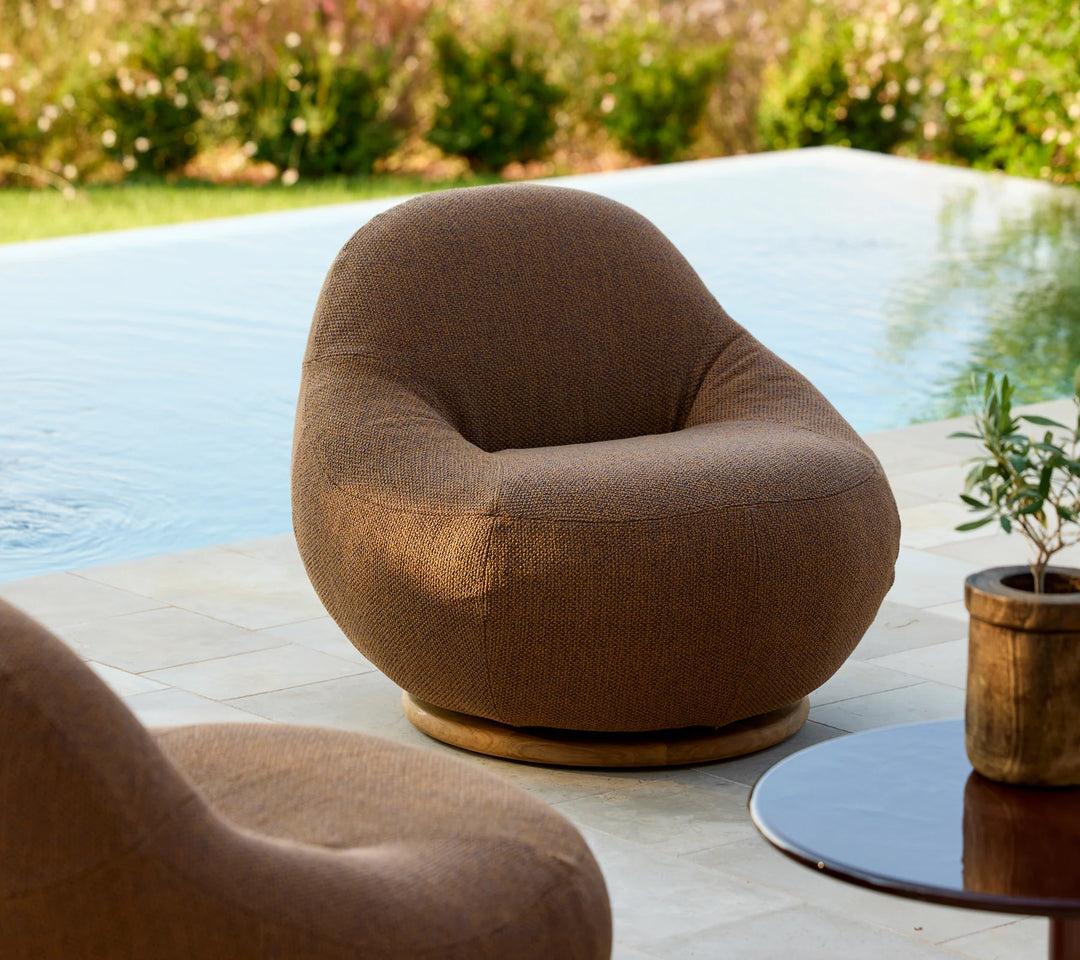 Gem lounge chair w/teak swivel Chairs Cane-line