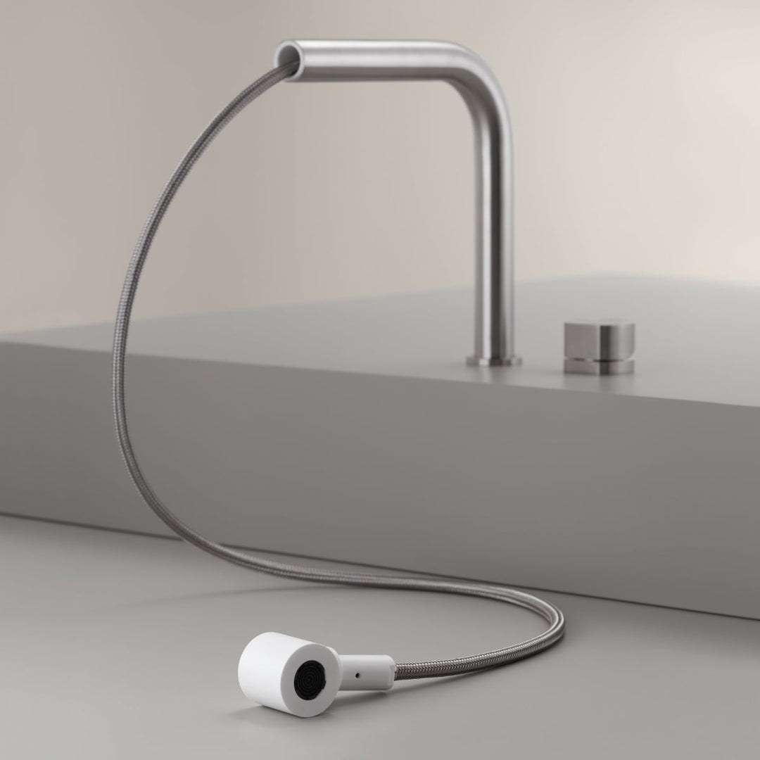 Two Hole Mixers With Pull Out Hand Shower Two-hole mixer with swivelling spout and pull-out Delrin® hand shower. Removable spout for under-window installation