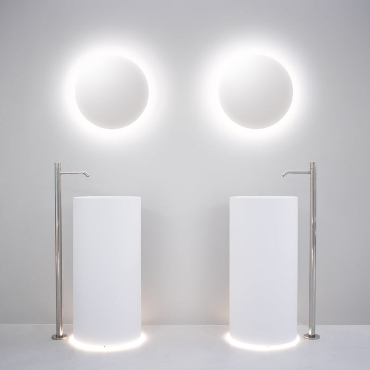 Washbasins Freestanding washbasin (Ø 425 mm, H. 900 mm) in Biobased Solid Surface with floor drainage and LED floor lighting (3000K). Siphoned free flow waste drain (PIL31) not included Washbasins CEA Design