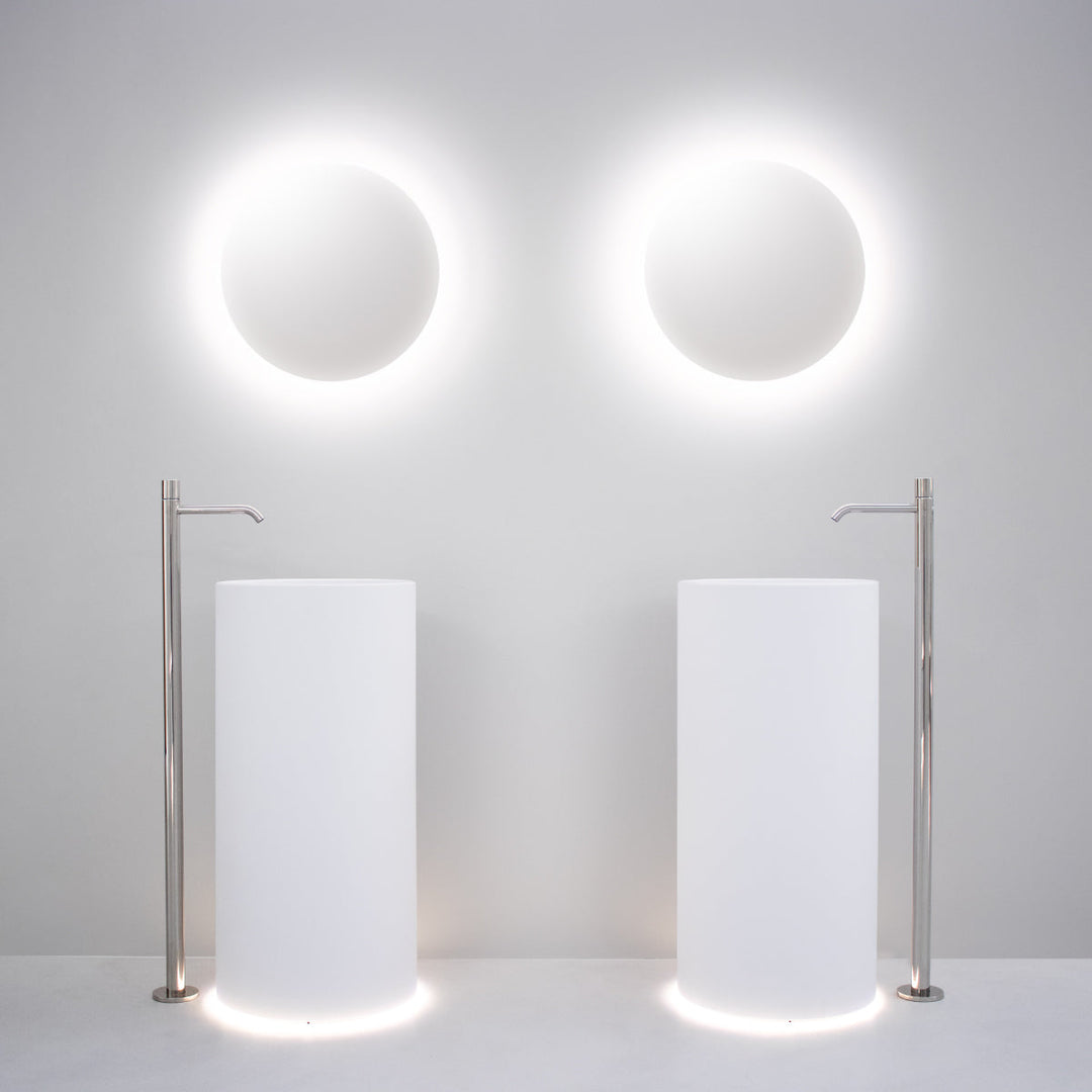 Washbasins Freestanding washbasin (Ø 425 mm, H. 900 mm) in Biobased Solid Surface with wall drainage and LED floor lighting (3000K). Siphoned free flow waste drain (PIL31) not included Washbasins CEA Design
